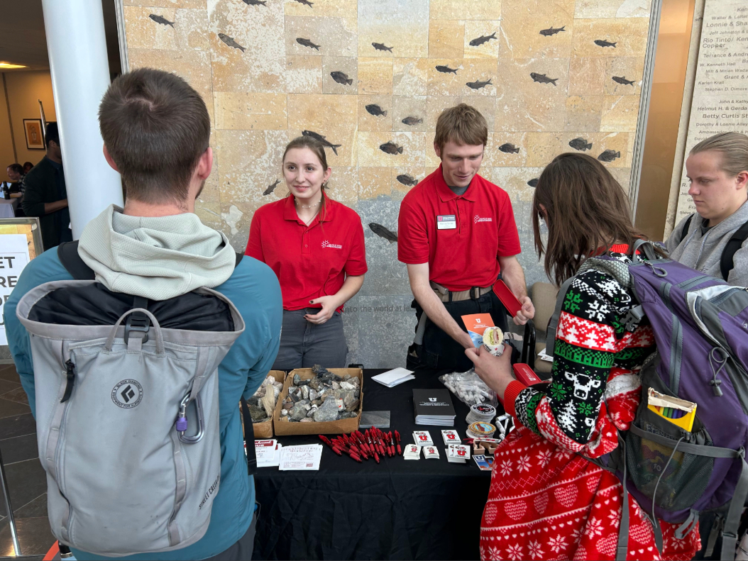 Students at Geofest talking with other students