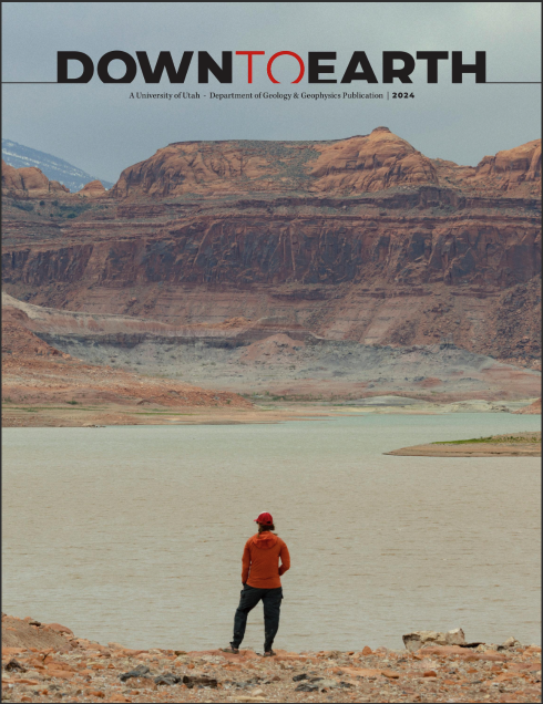 2024 newsletter cover of man standing in front of lake with red rock in the background.