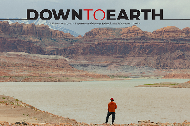 Down to Earth 2024 Cover of lake with red rocks.